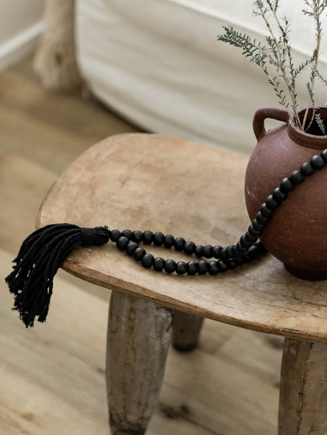 Ornement en perles de bois - noir